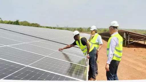 men at a solar power field